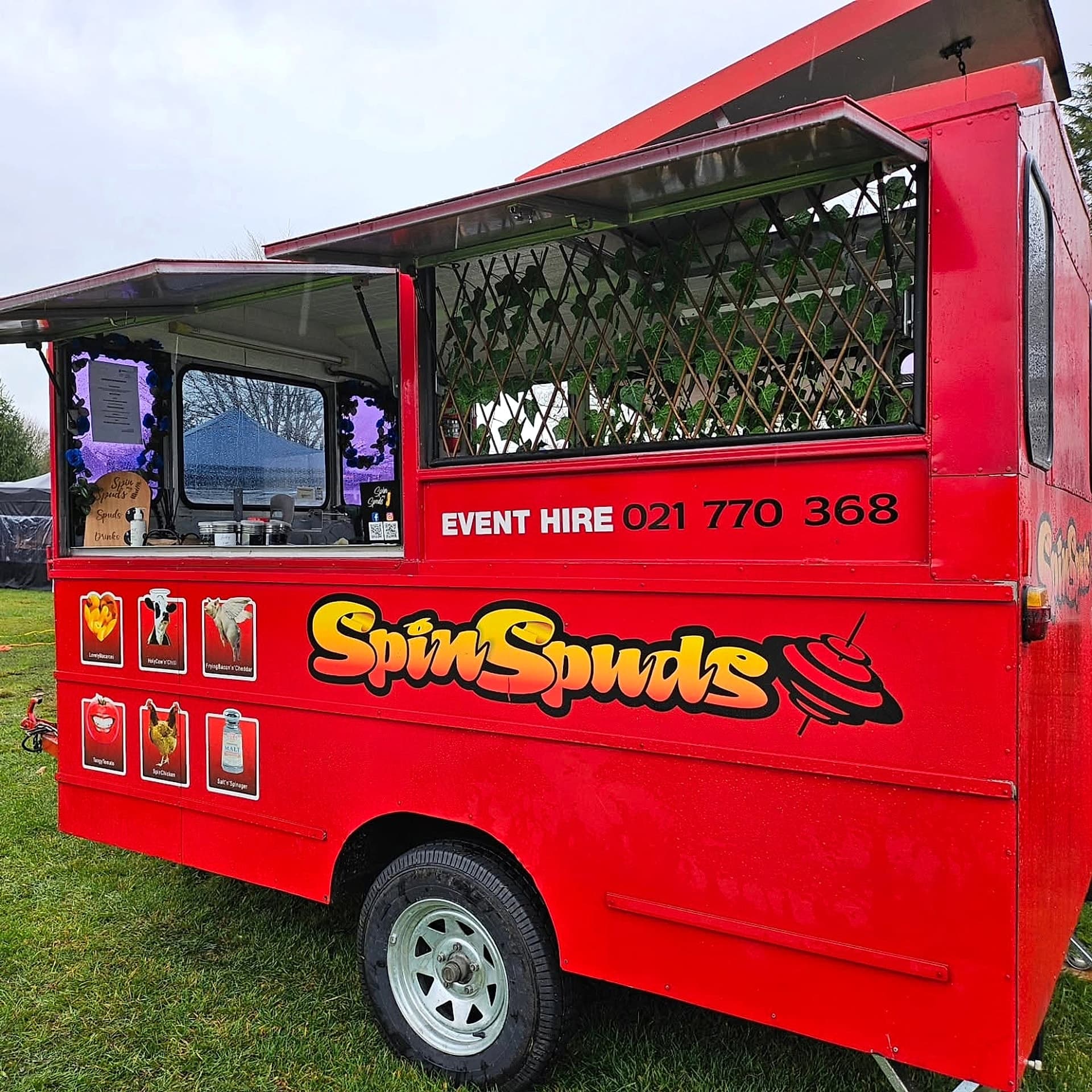 The SpinSpuds red food truck set up at an event